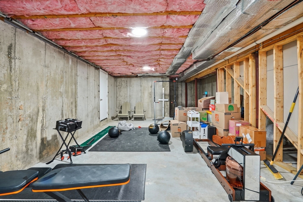27 Pine Street, Unit 27 Dedham, MA 02026 - Photo 31 of 35 a view of a room with gym equipment