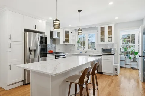 a kitchen with a table and chairs in it