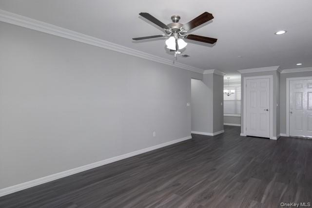1000 Saddle Rock Road, Unit 1203 Holbrook, NY 11741 - Photo 6 of 12 an empty room with wooden floor and windows