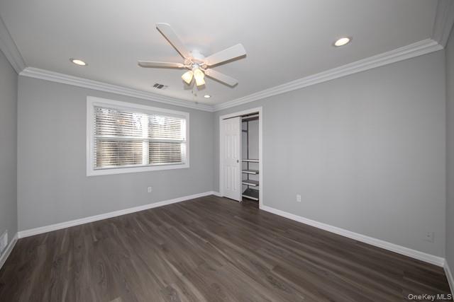1000 Saddle Rock Road, Unit 1203 Holbrook, NY 11741 - Photo 7 of 12 wooden floor in an empty room with a window