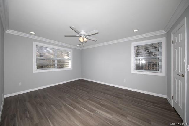 1000 Saddle Rock Road, Unit 1203 Holbrook, NY 11741 - Photo 10 of 12 a view of an empty room with wooden floor and a window