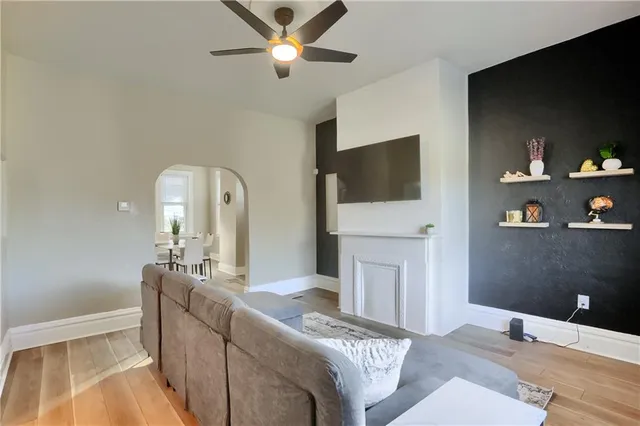 a living room with fireplace furniture and a flat screen tv