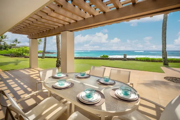 a view of a patio with furniture and backyard