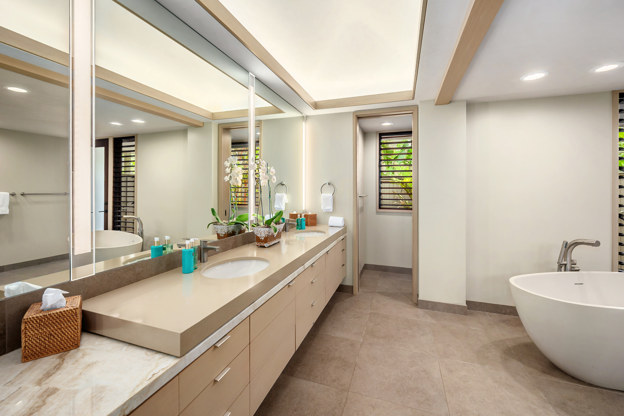 4890 Lawai Road Koloa, HI 96756 - Photo 16 of 30 a spacious bathroom with a double vanity sink and a bathtub