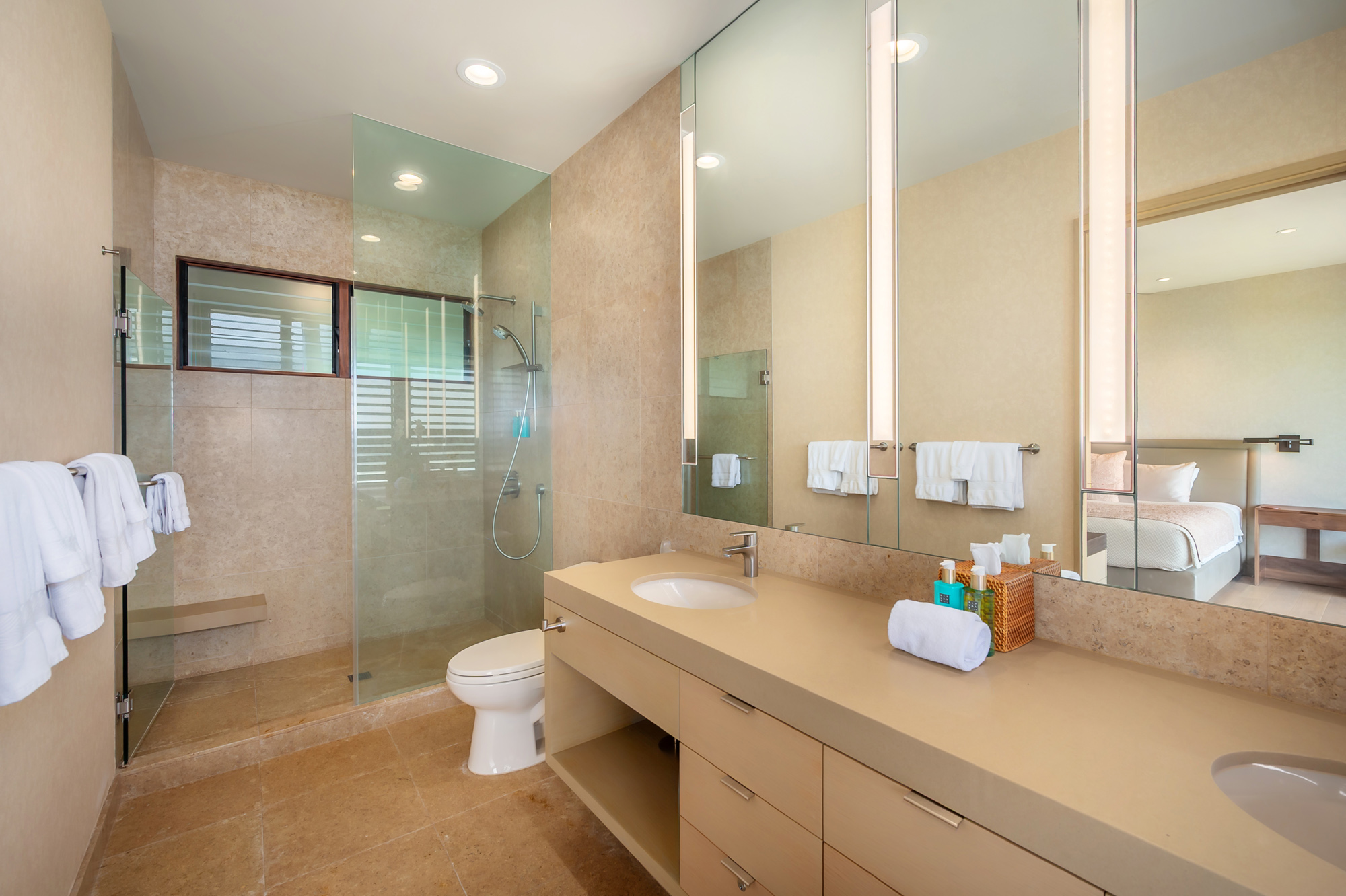 4890 Lawai Road Koloa, HI 96756 - Photo 26 of 30 a bathroom with a granite countertop sink a toilet and shower