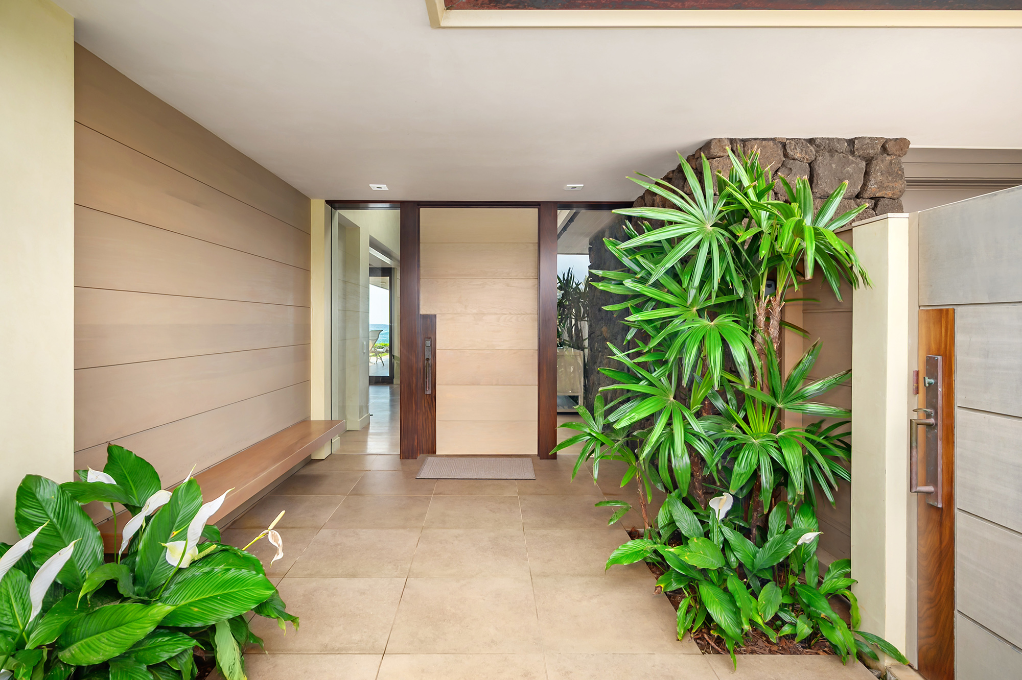 4890 Lawai Road Koloa, HI 96756 - Photo 4 of 30 a potted plant sitting in front of a door