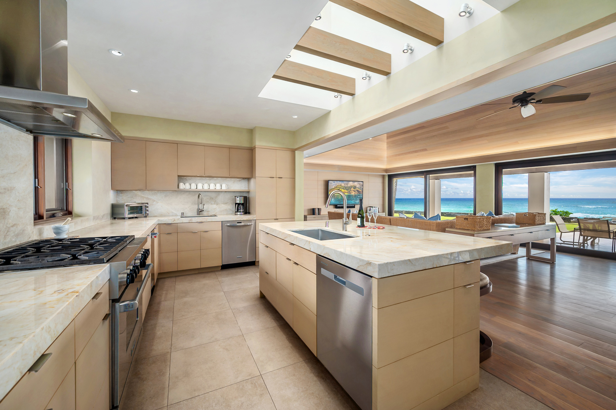 4890 Lawai Road Koloa, HI 96756 - Photo 9 of 30 a kitchen with a stove sink and cabinets