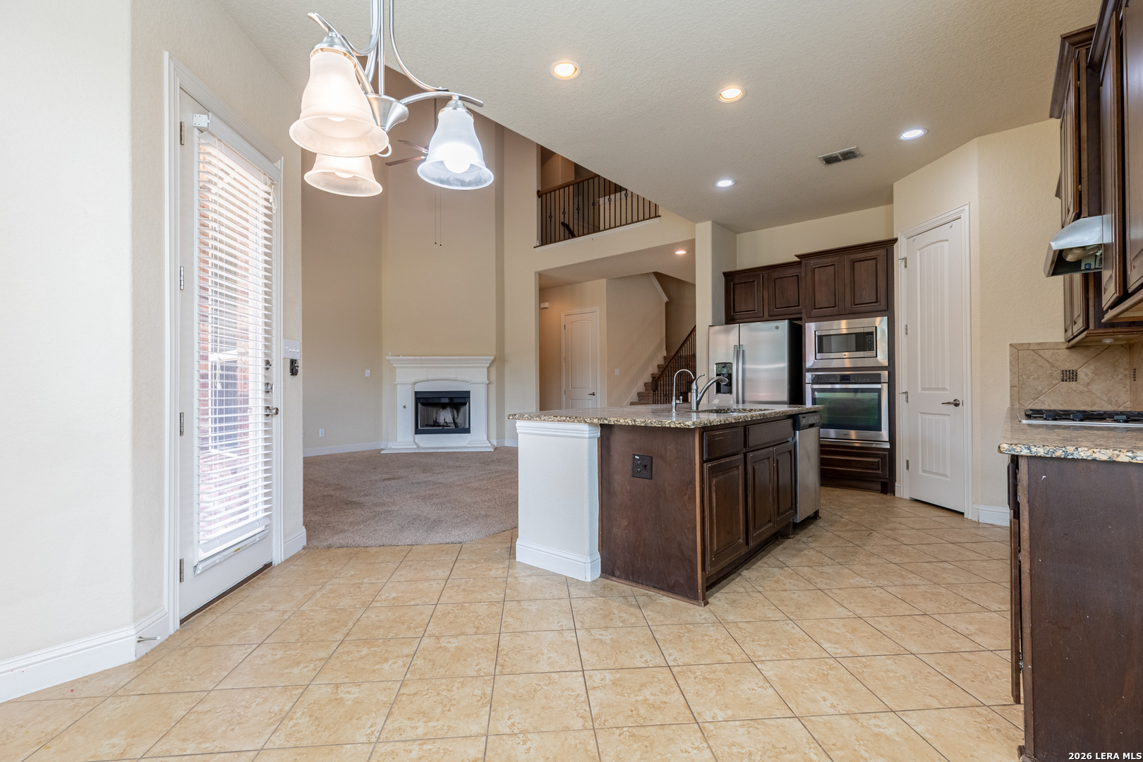 8103 Mystic Chase Boerne, TX 78015 - Photo 20 of 49 a large kitchen with a large counter top stainless steel appliances and cabinets