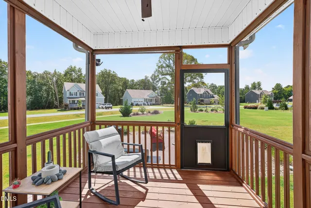 a view of a balcony with wooden floor