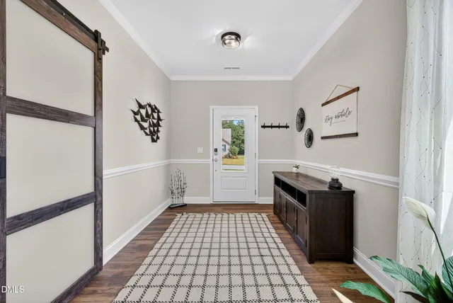 a view of a hallway view with wooden floor and staircase
