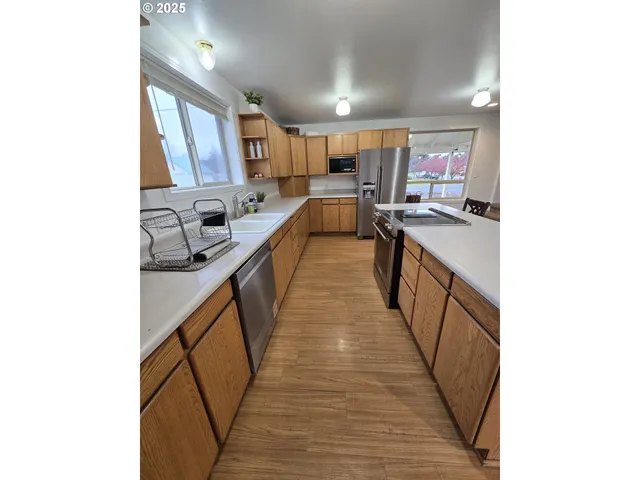a kitchen with counter top space and appliances