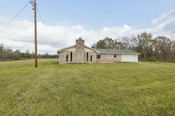 a house view with swimming pool