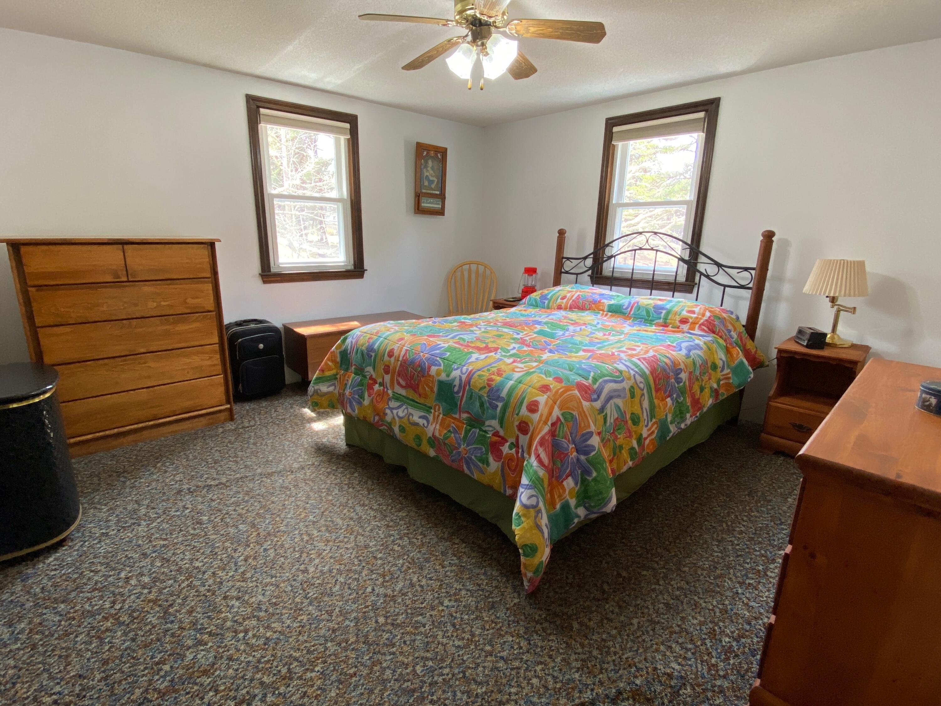 380 Foxwood Drive Eastham, MA 02642 - Photo 11 of 37 a bed sitting in a bedroom next to a window