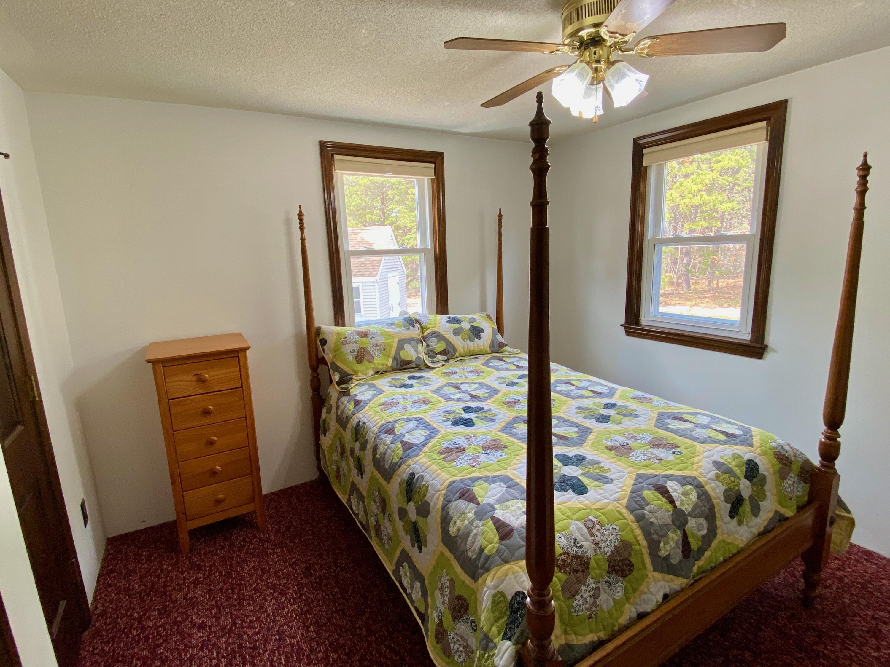 380 Foxwood Drive Eastham, MA 02642 - Photo 12 of 37 a bedroom with a bed and a window