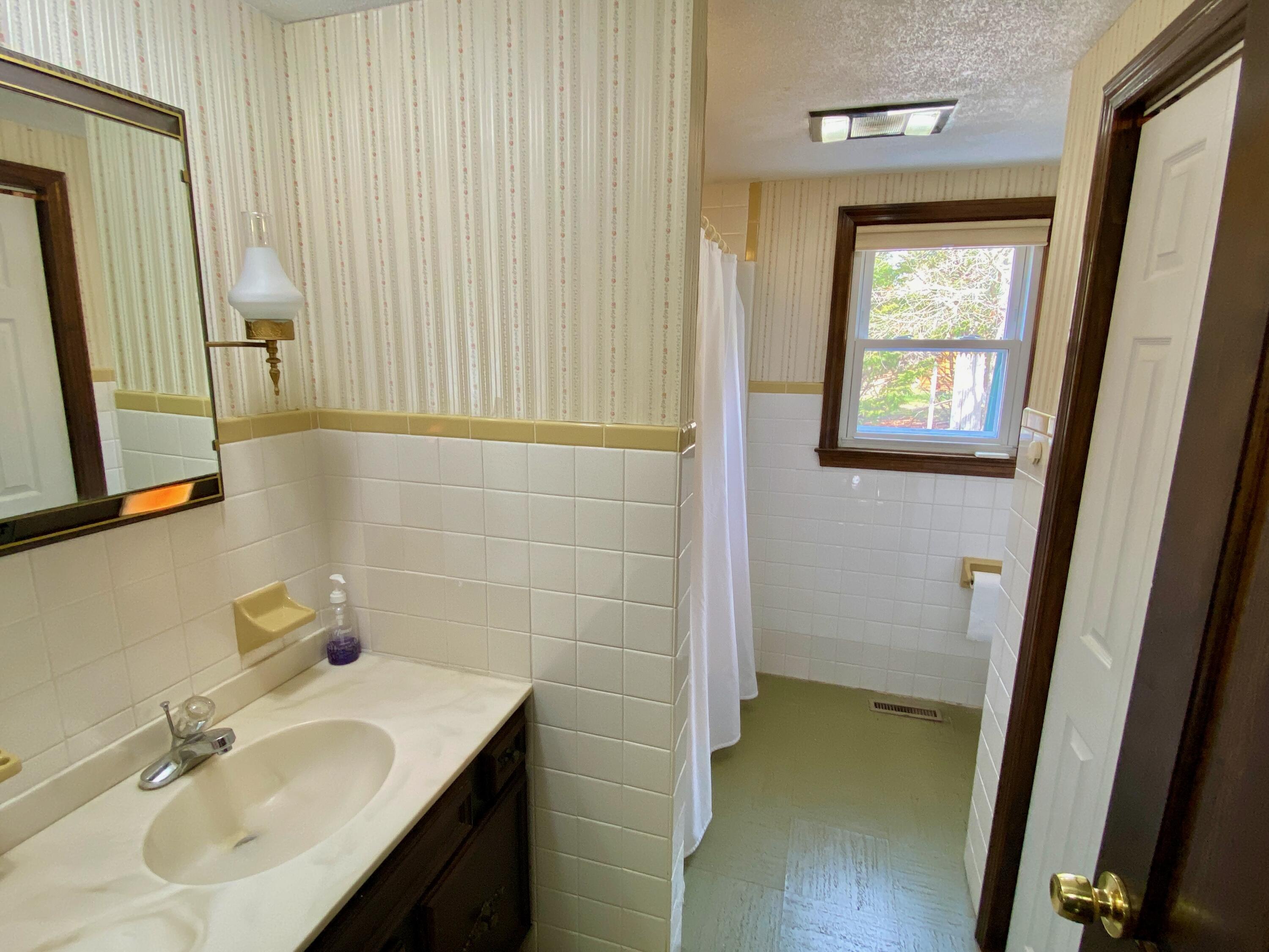 380 Foxwood Drive Eastham, MA 02642 - Photo 19 of 37 a bathroom with a sink a mirror and a shower