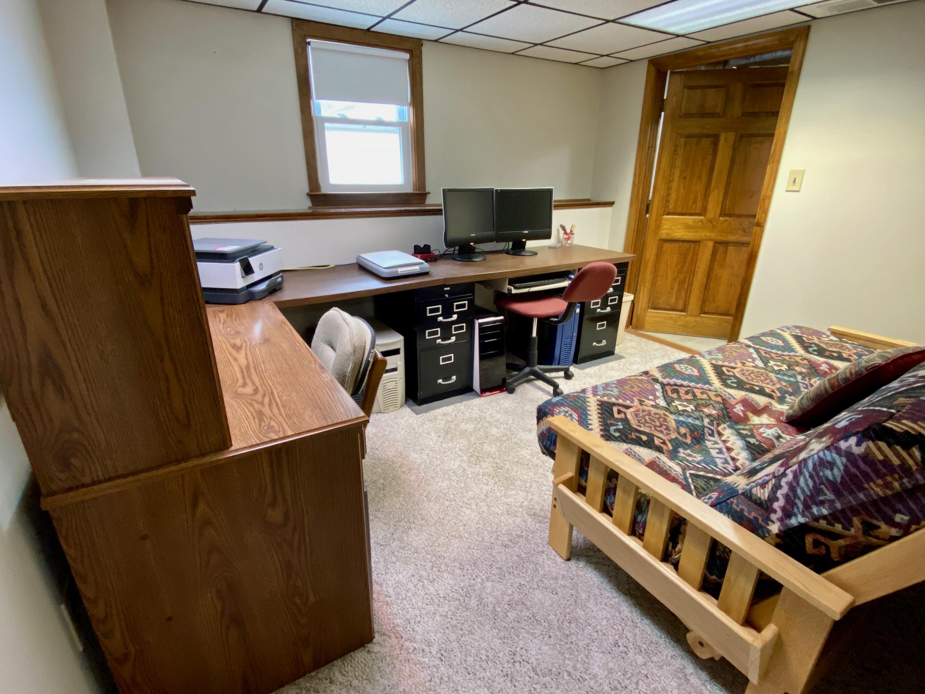 380 Foxwood Drive Eastham, MA 02642 - Photo 21 of 37 a living room with a bed furniture and a window