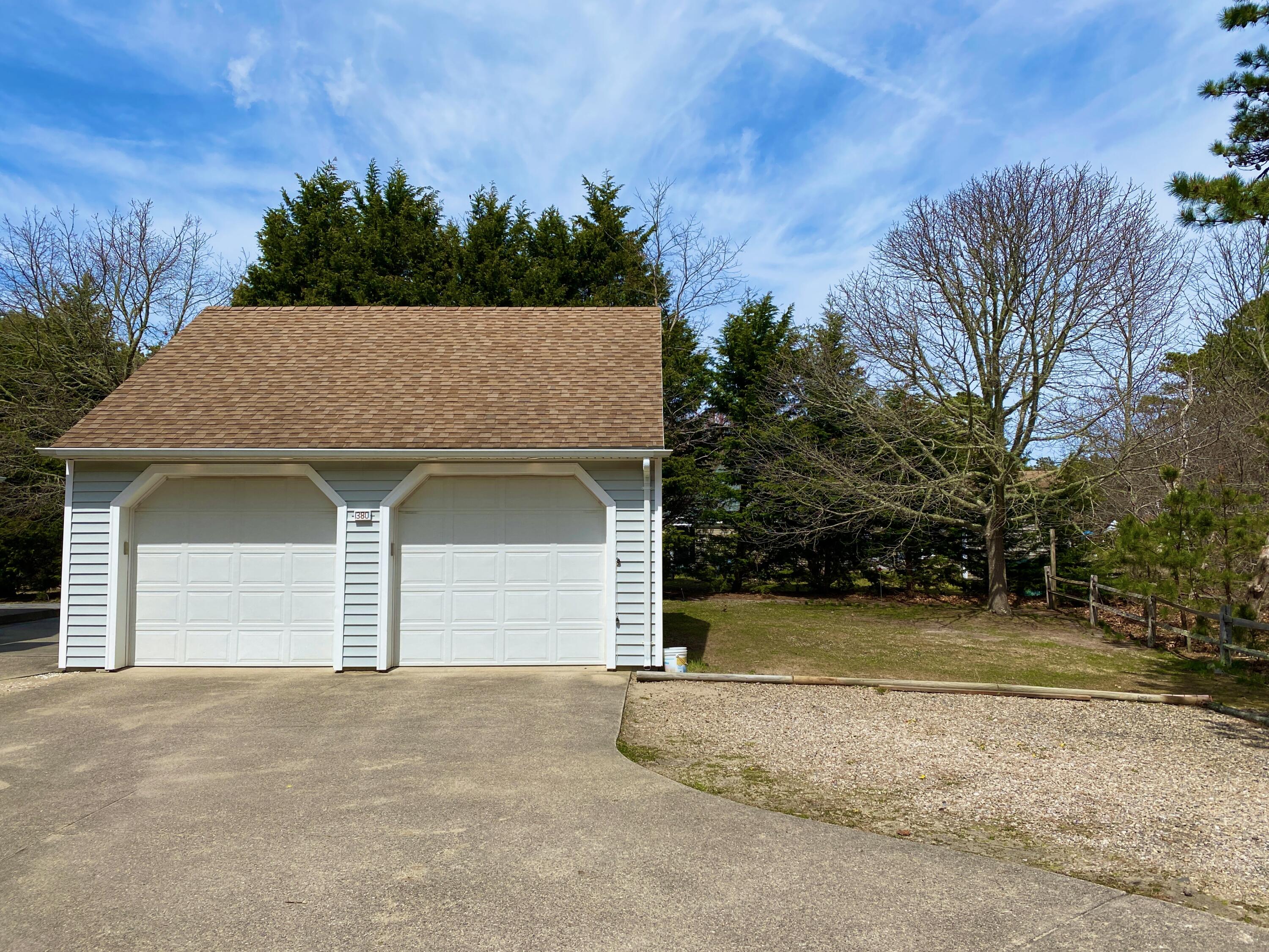 380 Foxwood Drive Eastham, MA 02642 - Photo 28 of 37 a house with trees in the background