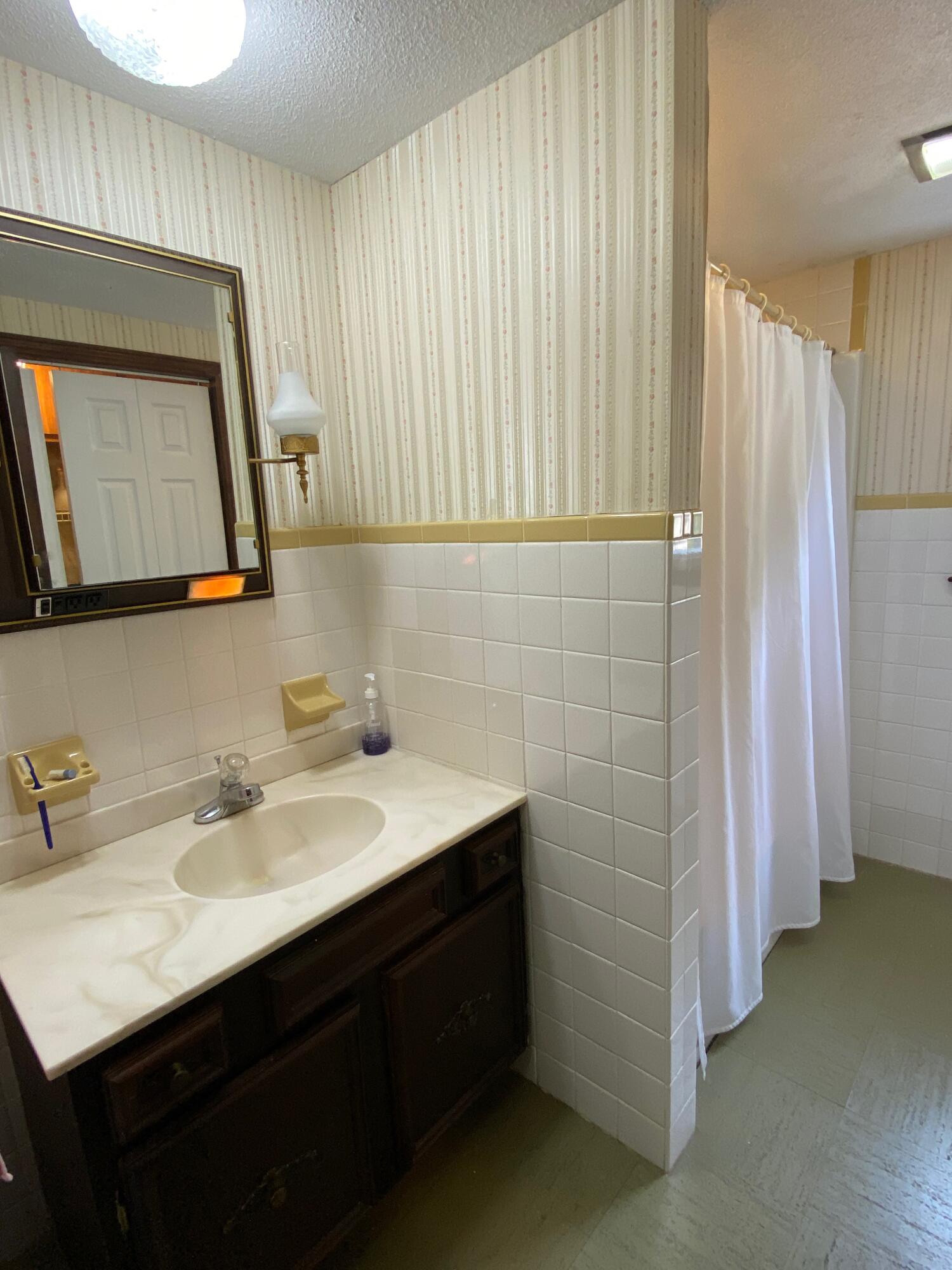 380 Foxwood Drive Eastham, MA 02642 - Photo 9 of 37 a bathroom with a sink vanity and a mirror