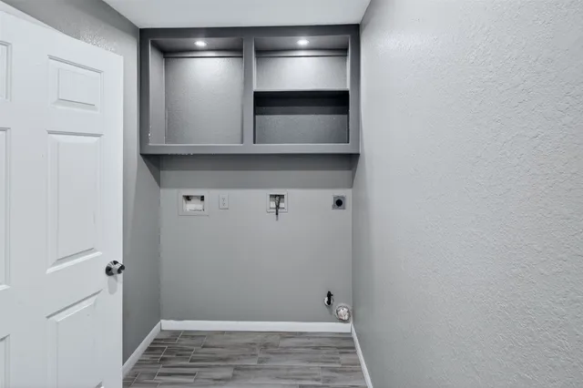 a kitchen with stainless steel appliances granite countertop a sink and cabinets