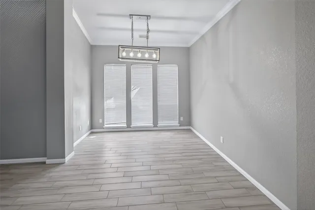 a view of hallway with wooden floor