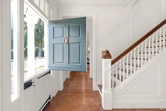 a view of a dining room with furniture window and wooden floor