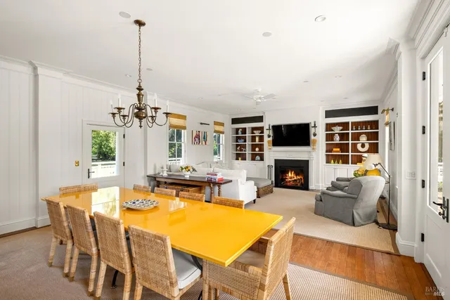 a living room with a fireplace and a flat screen tv