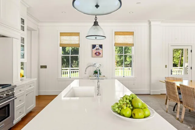 a view of a chairs and table on the wooden deck
