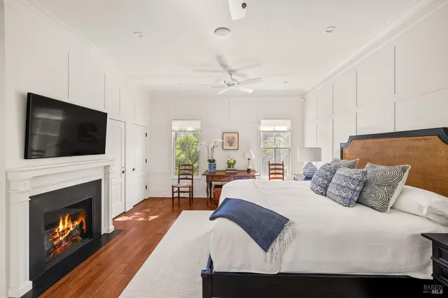 a bedroom with a bed and a table