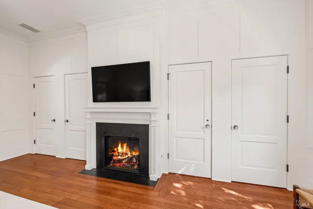 a bedroom with a bed couch and window