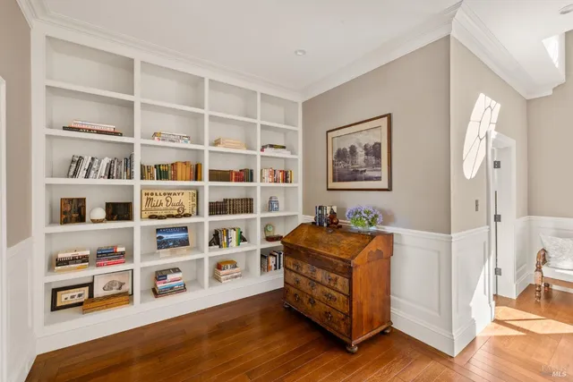 a view of a swimming pool and lounge chairs in the patio