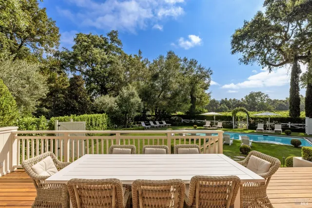 a view of a patio with couches chairs and a fire pit