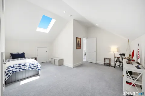 a bedroom with a bed and gym equipment