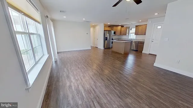 a view of kitchen and wooden floor