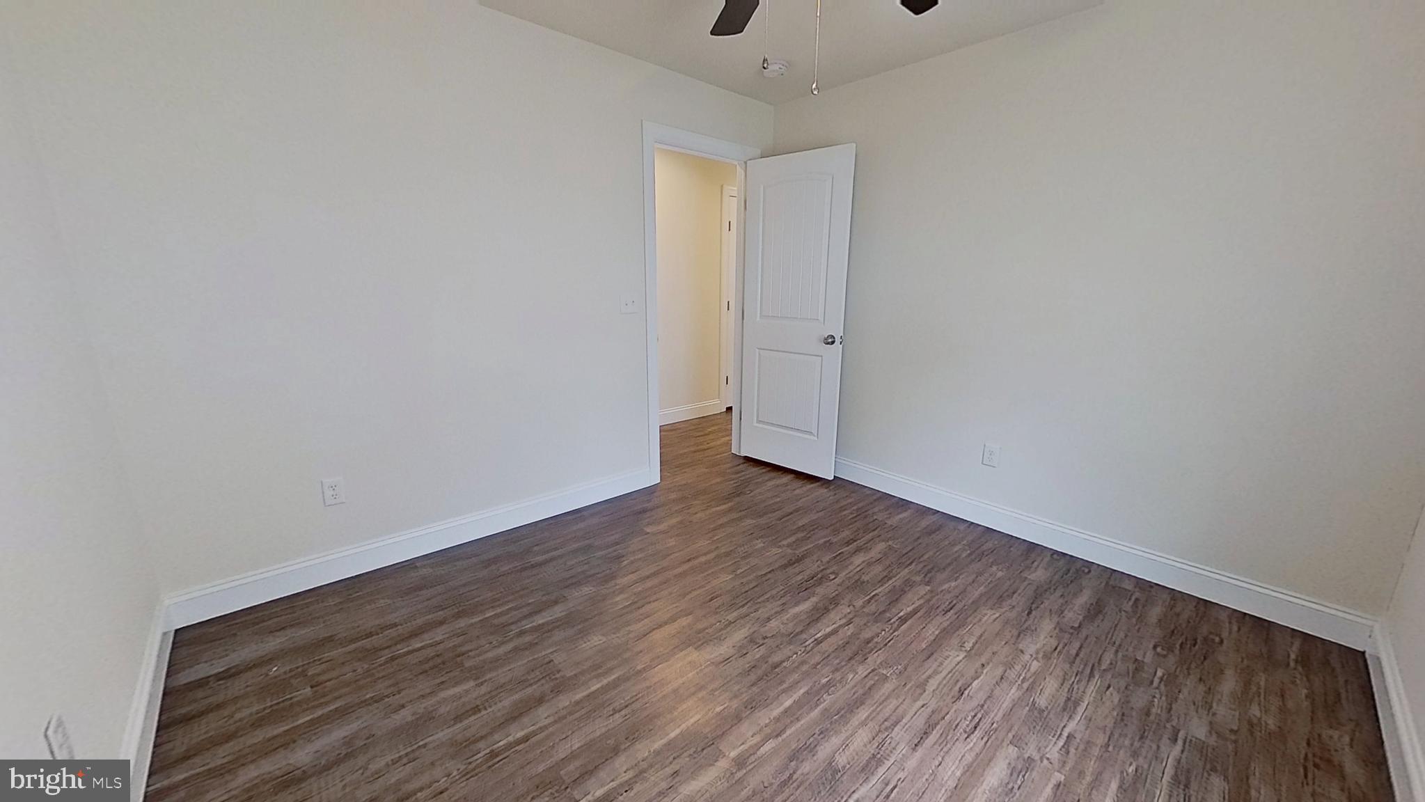 10 Evan Drive York, PA 17404 - Photo 7 of 11 a view of an empty room with wooden floor