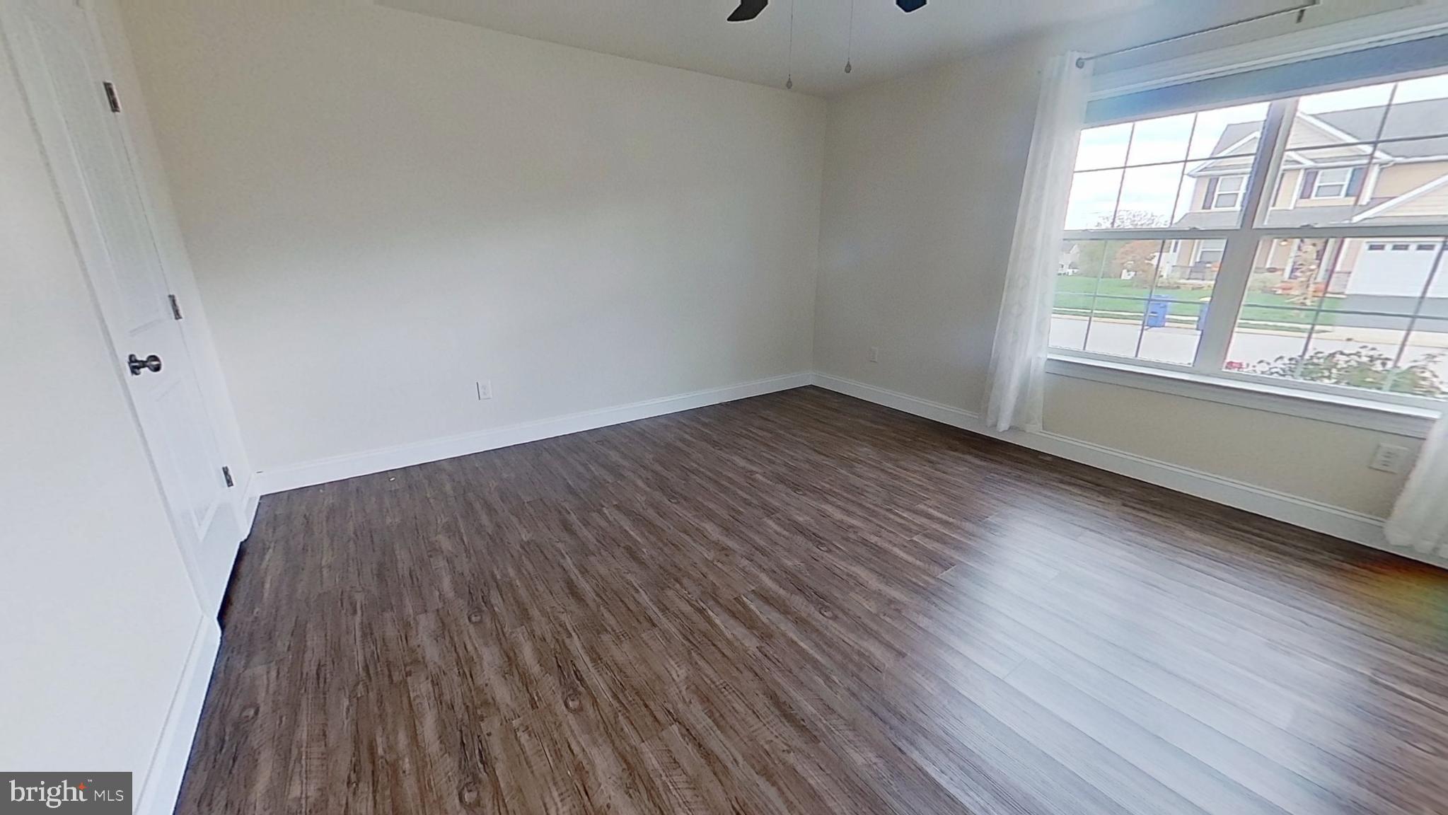 10 Evan Drive York, PA 17404 - Photo 9 of 11 a view of a room with wooden floor and windows