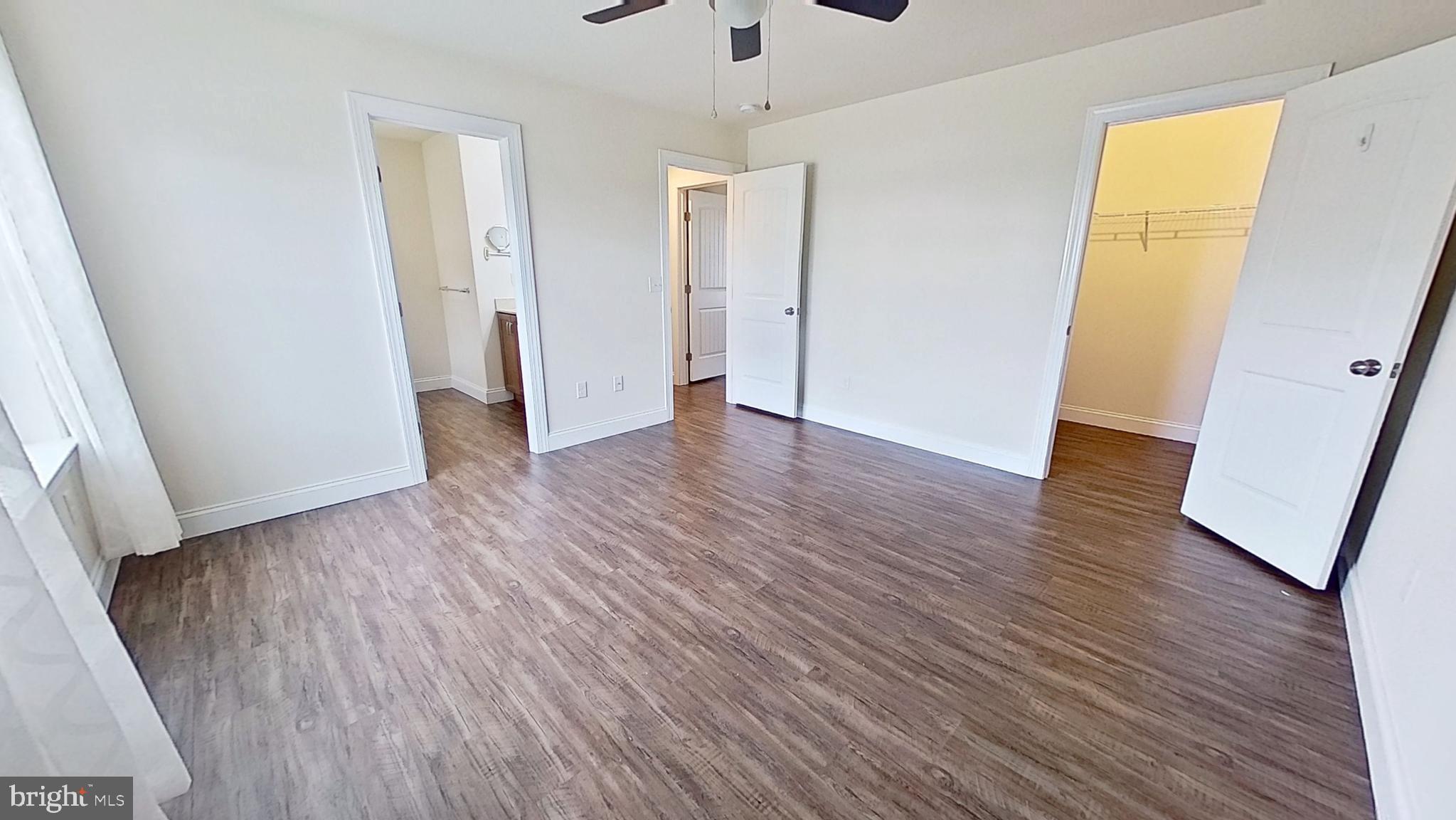 10 Evan Drive York, PA 17404 - Photo 10 of 11 an empty room with wooden floor and a ceiling fan