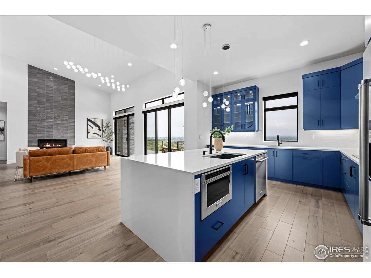 2145 Picture Point Drive Windsor, CO 80550 - Photo 10 of 40 a kitchen with stainless steel appliances granite countertop a stove and a sink