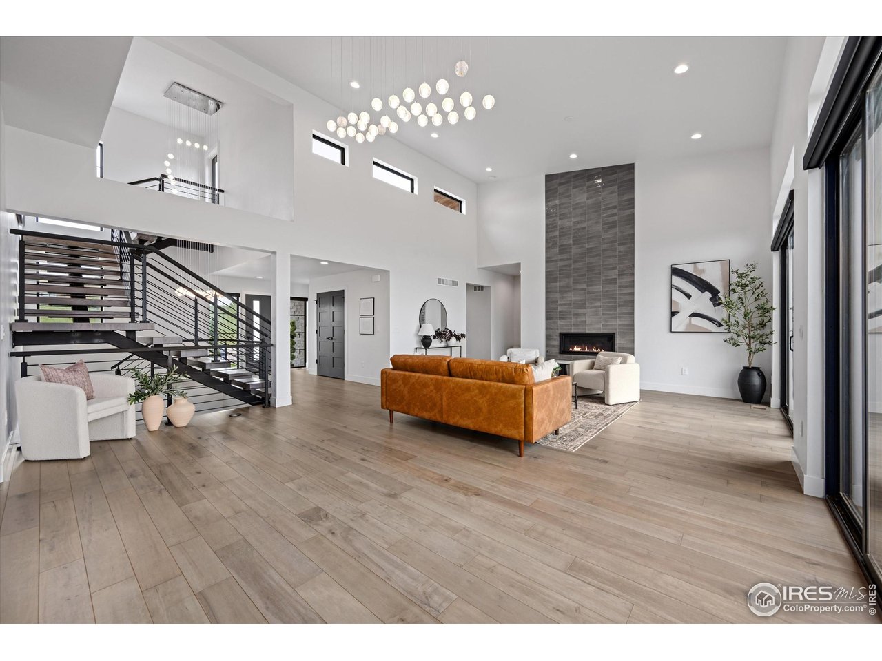 2145 Picture Point Drive Windsor, CO 80550 - Photo 11 of 40 a living room with furniture and a wooden floor