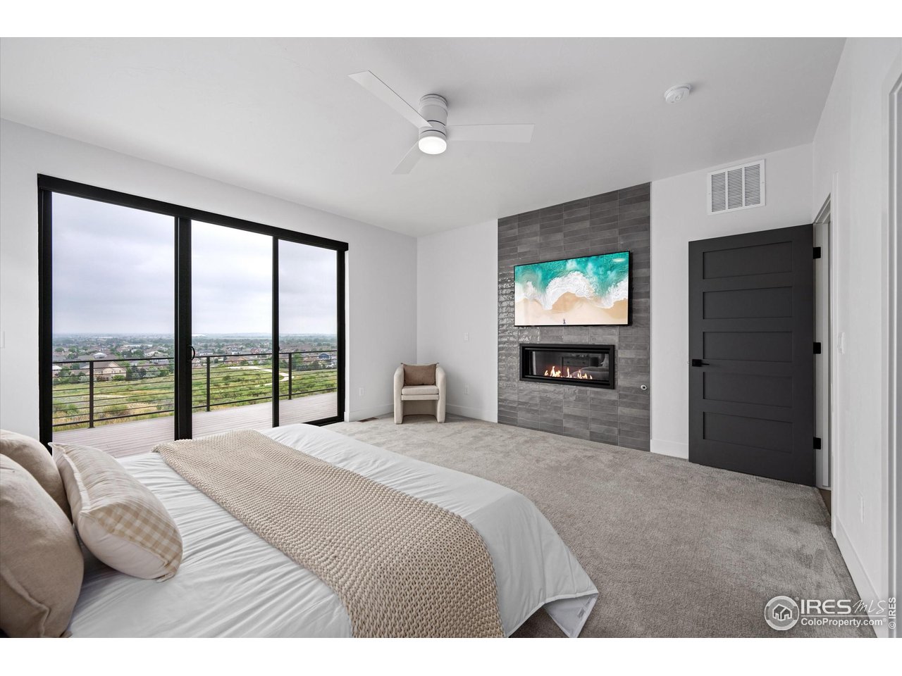 2145 Picture Point Drive Windsor, CO 80550 - Photo 13 of 40 a bedroom with a large bed and a large window