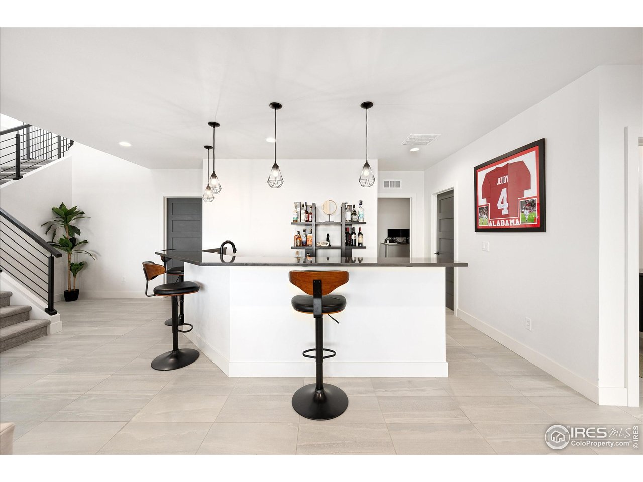 2145 Picture Point Drive Windsor, CO 80550 - Photo 31 of 40 a living room with furniture and a chandelier