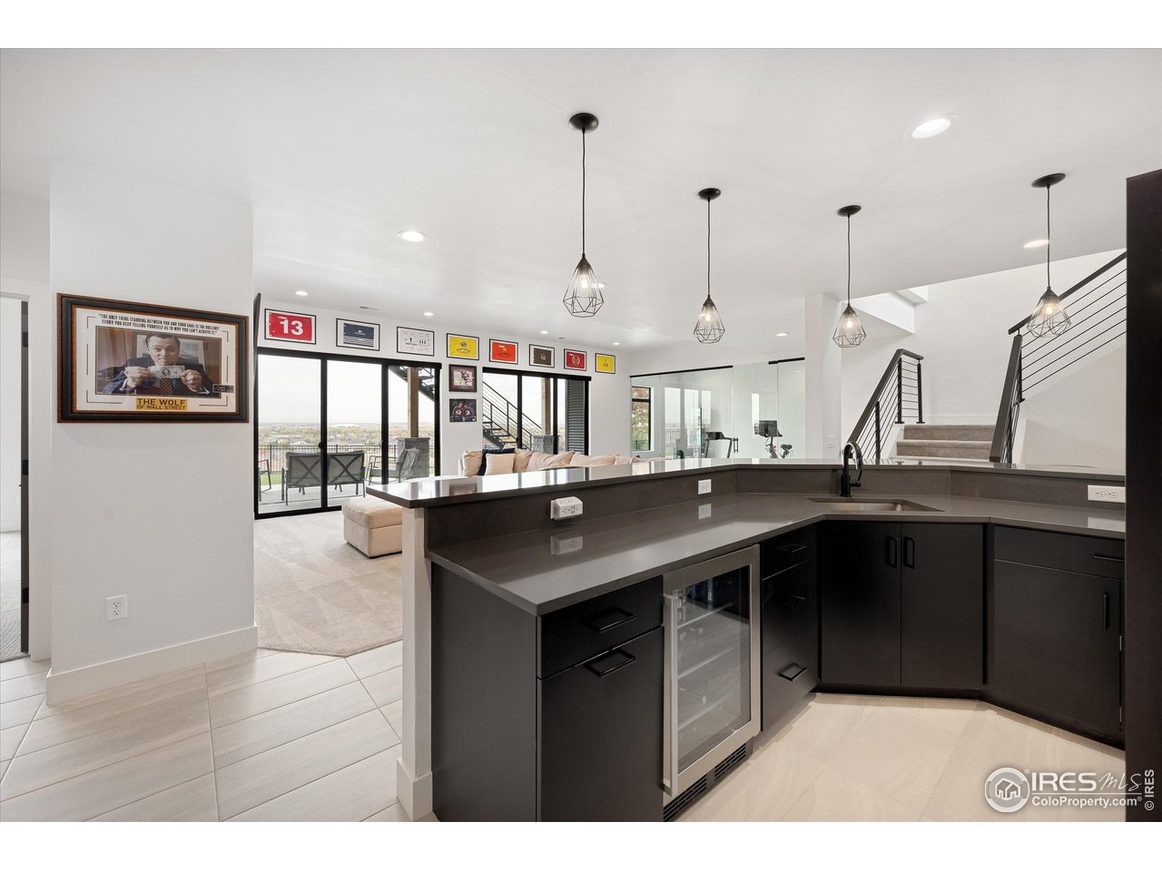 2145 Picture Point Drive Windsor, CO 80550 - Photo 40 of 40 a kitchen with stainless steel appliances granite countertop a sink and wooden cabinets
