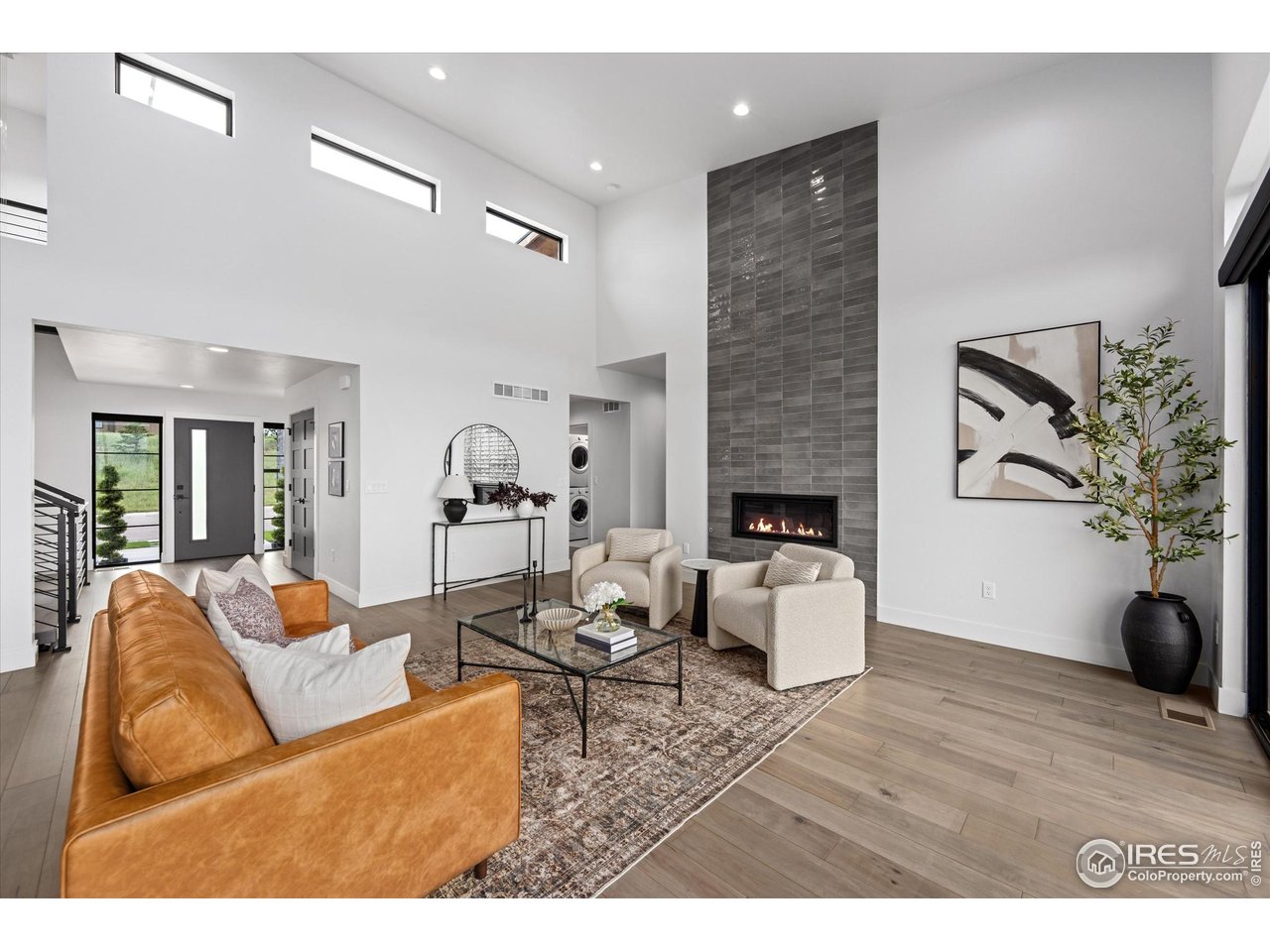 2145 Picture Point Drive Windsor, CO 80550 - Photo 5 of 40 a living room with furniture and wooden floor
