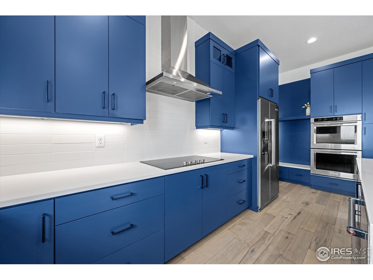 2145 Picture Point Drive Windsor, CO 80550 - Photo 8 of 40 a kitchen with wooden cabinets and stainless steel appliances