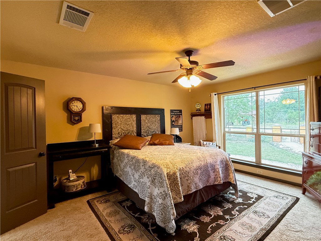 28799 Highway 83 Concan, TX 78838 - Photo 18 of 40 a bed sitting in a bedroom next to a window