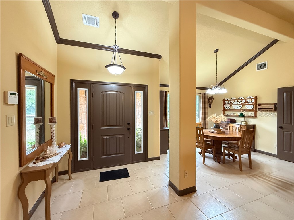 28799 Highway 83 Concan, TX 78838 - Photo 21 of 40 a view of a dining room with furniture and chandelier