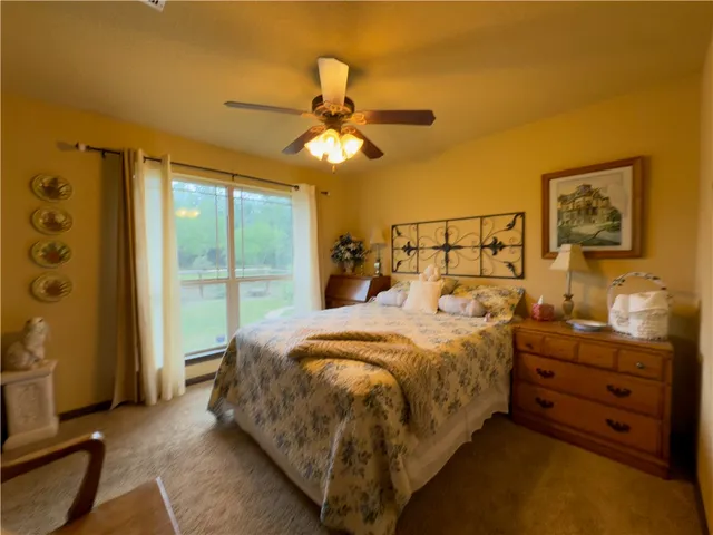 a bed room with a bed and a window