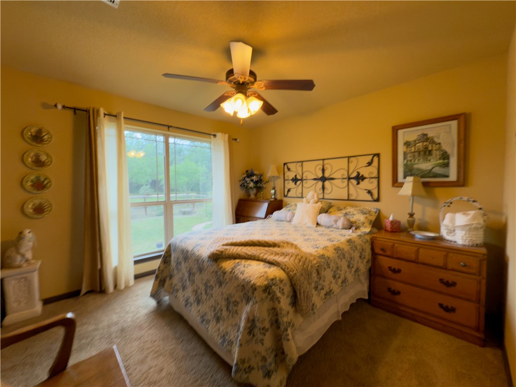 28799 Highway 83 Concan, TX 78838 - Photo 22 of 40 a bed room with a bed and a window