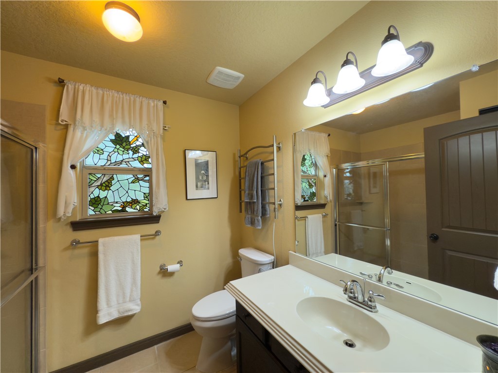28799 Highway 83 Concan, TX 78838 - Photo 25 of 40 a bathroom with a sink and a mirror
