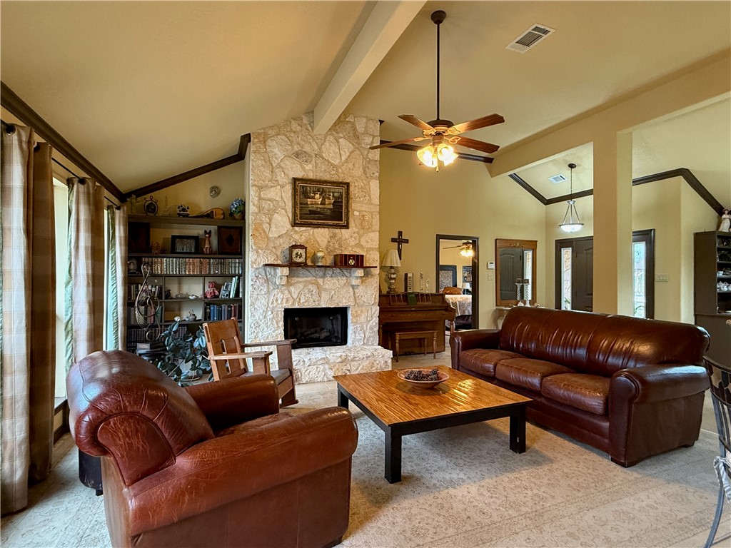 28799 Highway 83 Concan, TX 78838 - Photo 28 of 40 a living room with furniture a table and a chandelier