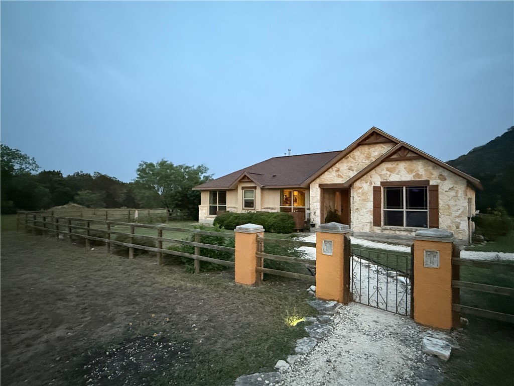 28799 Highway 83 Concan, TX 78838 - Photo 3 of 40 a front view of a house with a yard